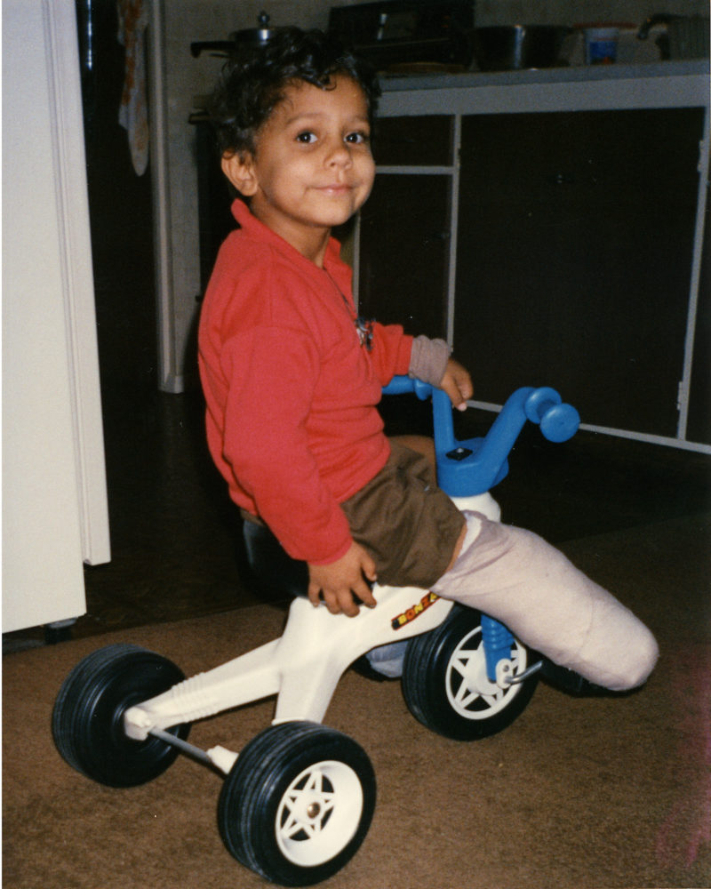 Child on tricycle